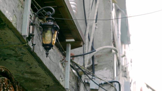 Old lantern on a weathered building