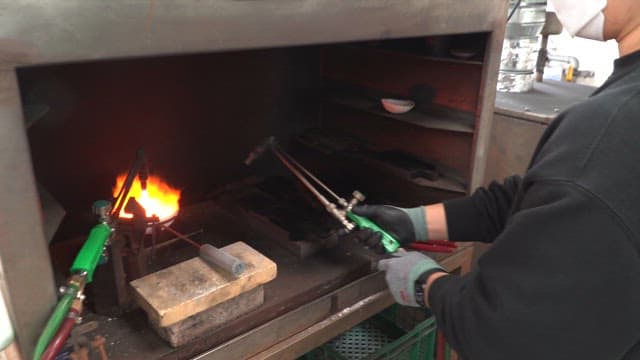 Metal being heated in a furnace