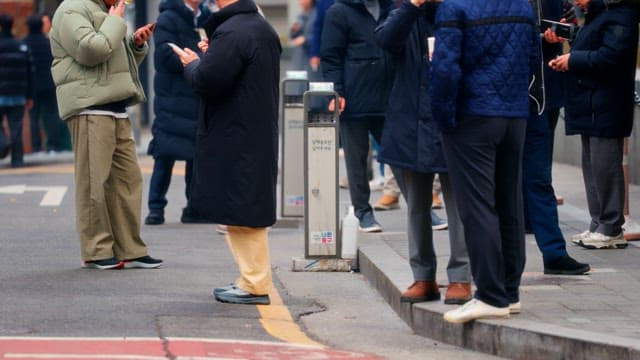 People smoking in smoking area