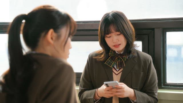 Students chatting by the window