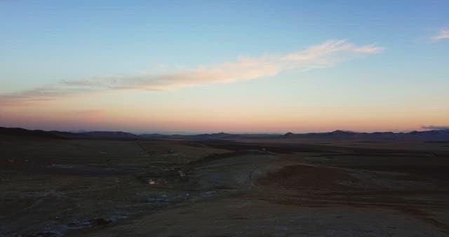 Vast landscape at sunset with distant hills