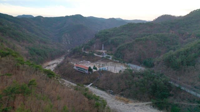 House Located in a Mountain Village Full of Trees