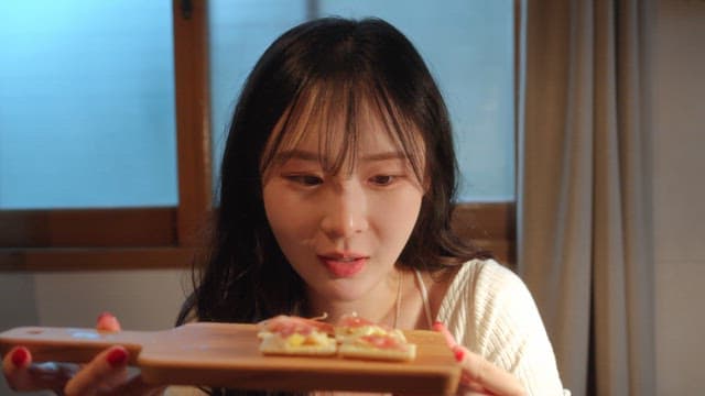 Woman looking at homemade canapes