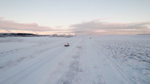 Car driving on a snowy road