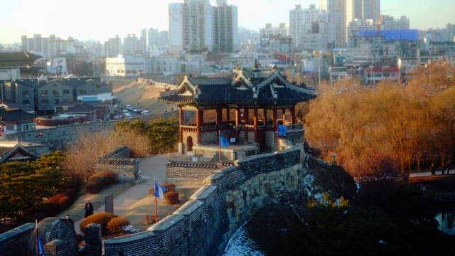 Traditional Korean fortress in a modern cityscape