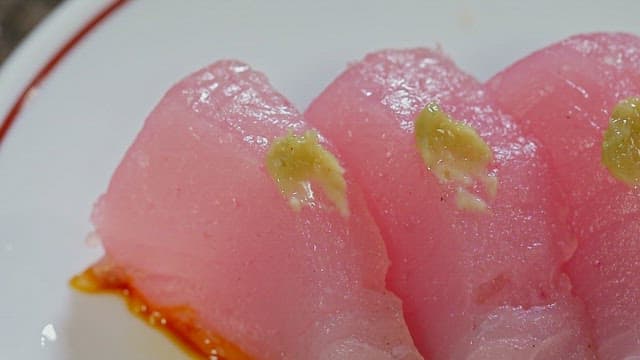 Slices of fresh tuna sushi with wasabi