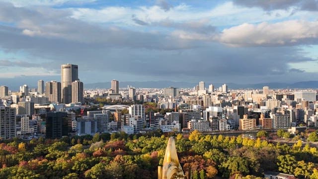 City skyline with lush green trees