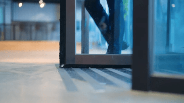 Person coming through revolving door