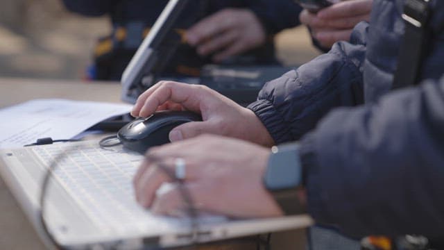 Professionals Researching Something Using Laptops