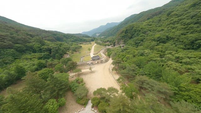Mountain fortress, a traditional building nestled in a dense forest