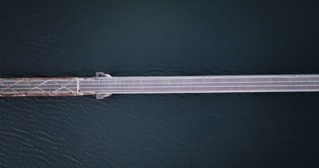 Bridge spanning over calm river