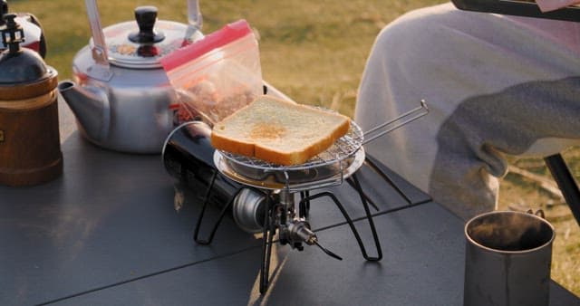 Preparing Toast on a Portable Grill Outdoors