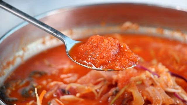 Spicy Cold Raw Fish Soup with Fresh Vegetables and Seafood