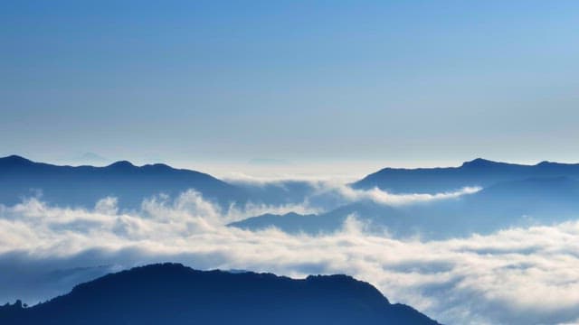 Sunrise over clouds and mountains