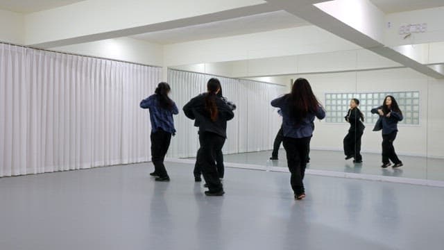 K-POP Dancers Practicing in a Studio