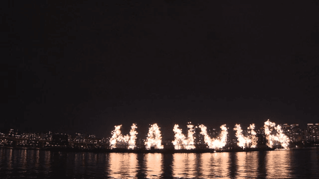 Colorful Fireworks Display Over the City Skyline and River