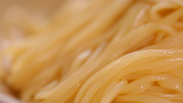 Close-up of cooked noodles with fried egg