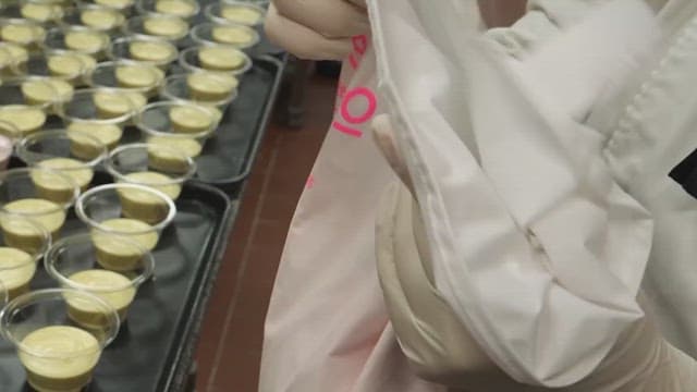 Piping bag filled with creamy and thick cream