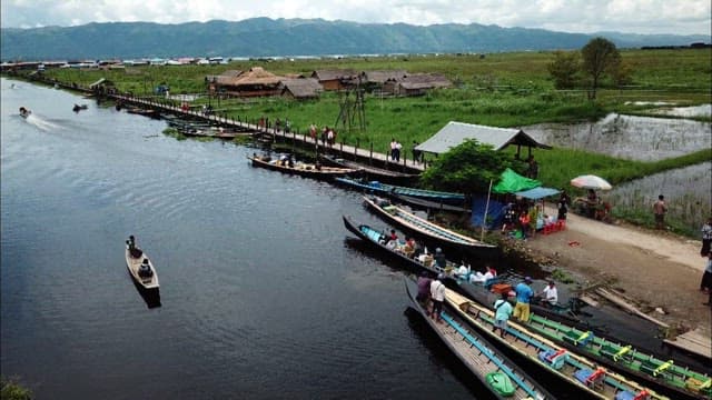 Boats Speeding Across a Scenic Inle Lake