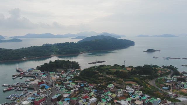 Coastal village with distant islands