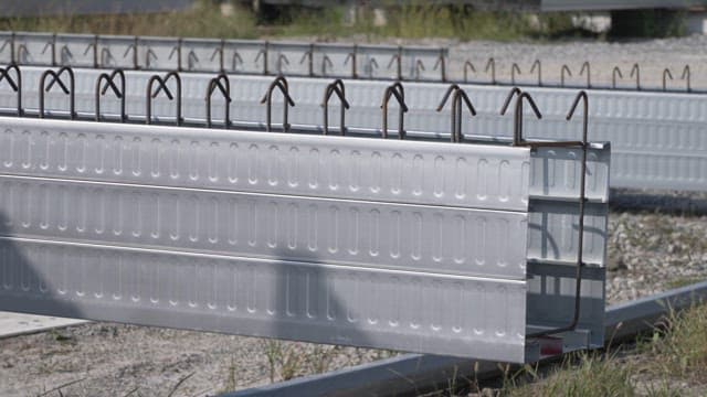 Metal beams stacked on a construction site