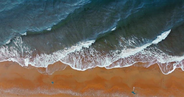 Waves Crashing on Sandy Shore