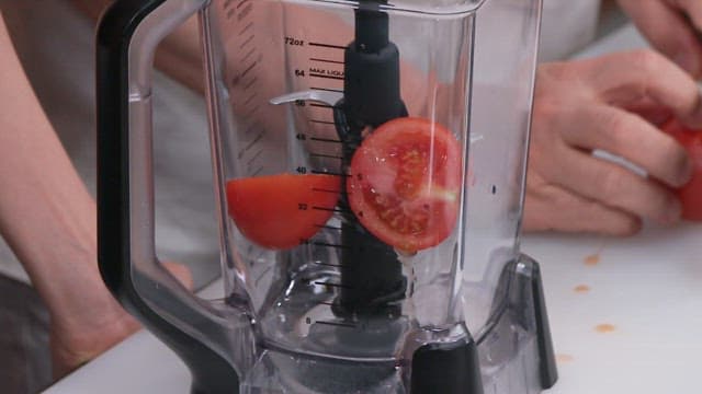 Putting Cut Tomatoes in Blender