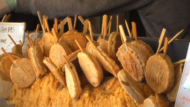 Street vendor displaying traditional Korean snacks