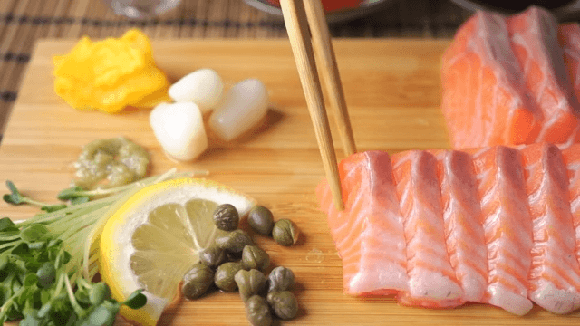 Fresh salmon sashimi served with ingredients