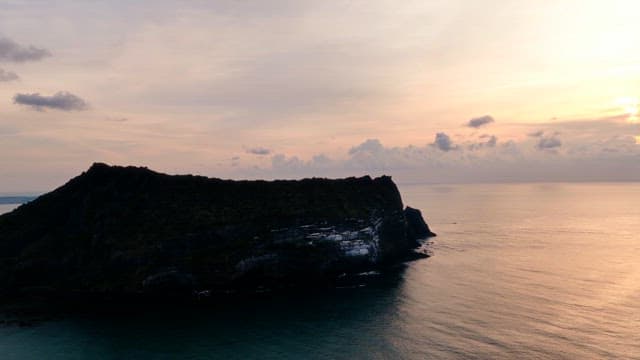 Serene coastal cliff at sunset