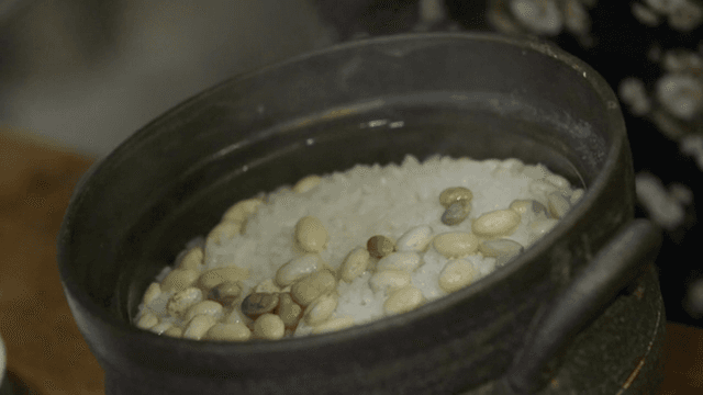 Hot bean rice prepared in a stone pot