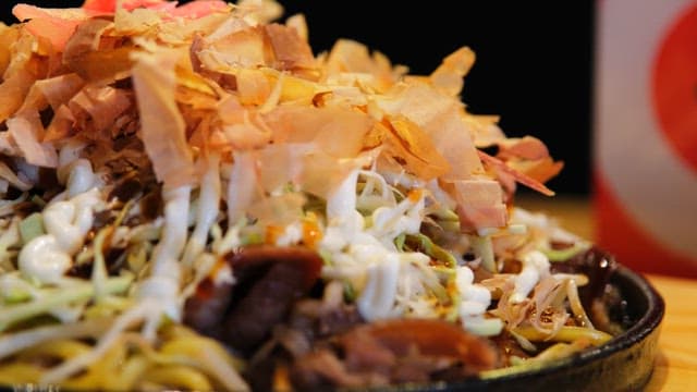 Delicious Yakisoba topped with katsuobushi and vegetables