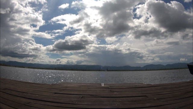 Serene Lake View with Cloudy Sky