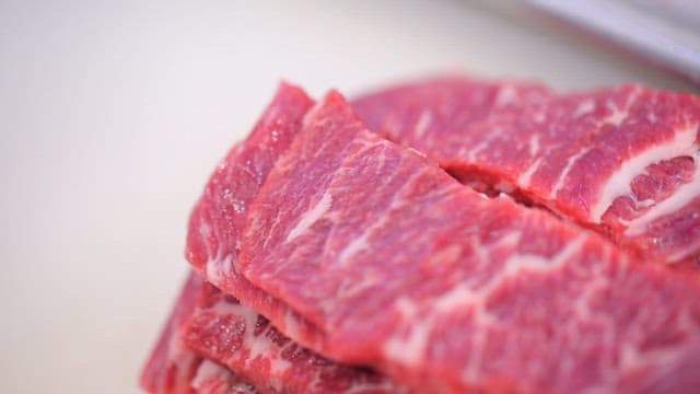 Close-up View of Marbled Raw Beef Slices