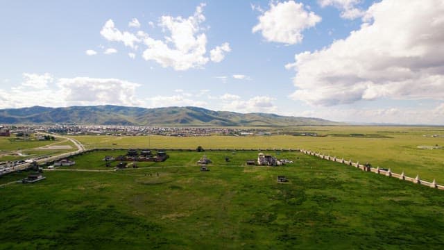 Temple in a Quiet Meadow Under a Blue sky