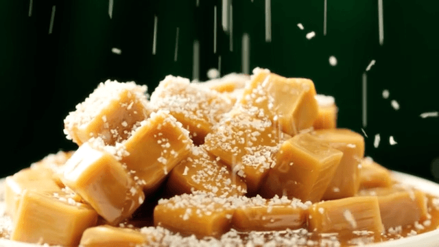 Sparkling sugar over caramels piled on a white plate
