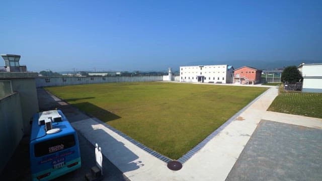 Peaceful Prison Yard under clear skies