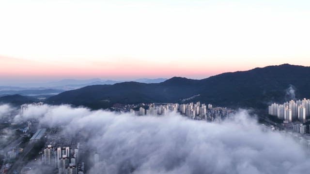 Sunrise over cloudy city