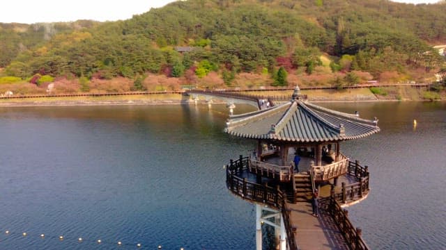 Traditional pavilion over a serene river