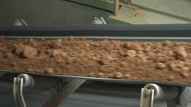 Conveyor belt transporting soil