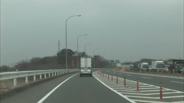 Roads clogged with trucks and cars on a cloudy day