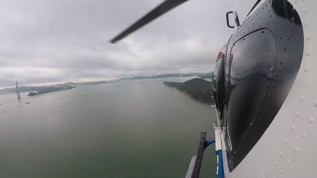 Aerial View of Helicopter Over a Coastal Area