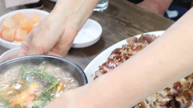 Sundae Gukbap served on a table with pig's feet
