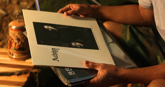 Man Listening to Music on a Vintage Turntable
