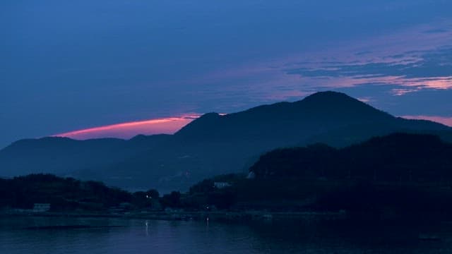 Twilight over a Serene Seaside Mountain Village