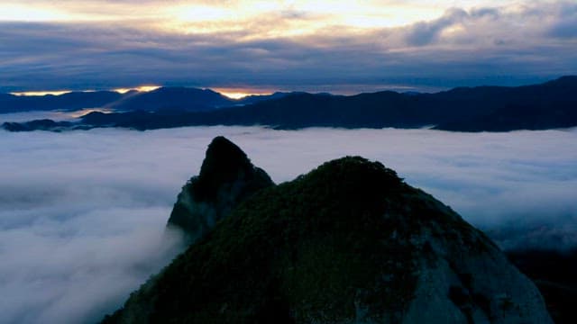 Sunrise above clouds on a mountain peak