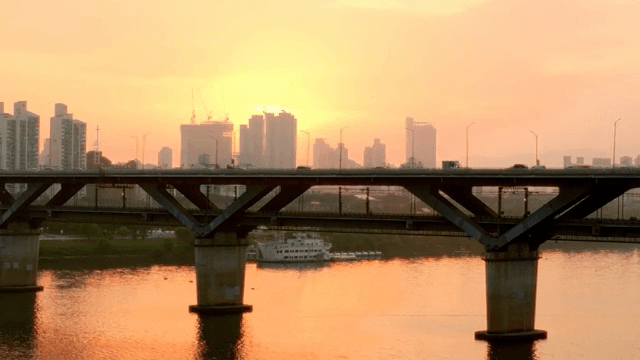 Sunset view over a city bridge and river