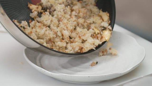 Delicious abalone fried rice served on a clean white plate
