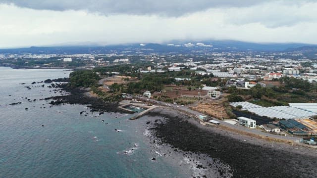 Coastal road with rocky shoreline