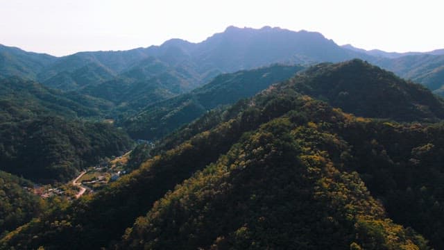 Village Between Mountainous Landscape